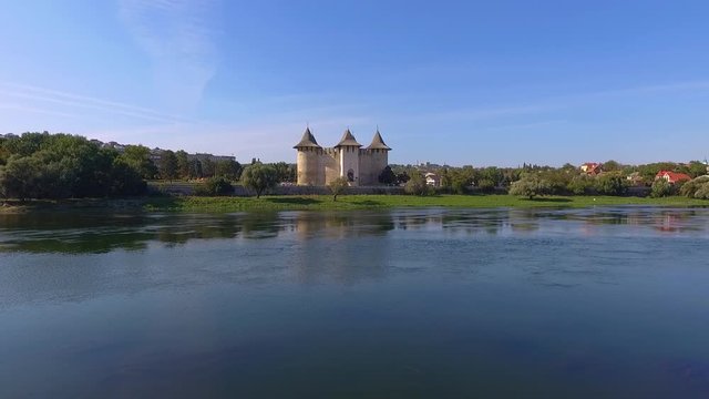 drone aerial shot of soroca fort reflected in water , view from nistru dnestr river