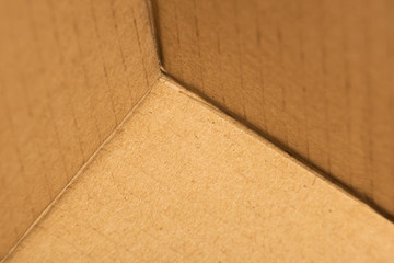 Background with empty cardboard box corner