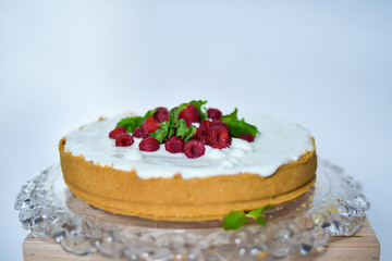 cheesecake decorated with raspberries and mint