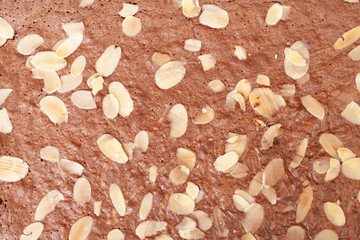 Background of fresh bake chocolate brownie and sliced almond