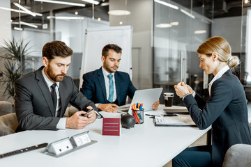 Business people sitting during a boring conference in the meeting room