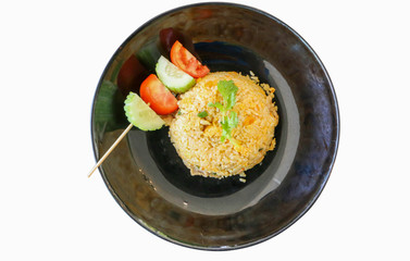 Curry fried rice and a black plate on a separate white background