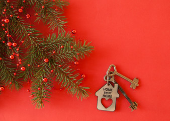 Christmas decoration: decorative house and key to the lock. Concept of finance and housing loans