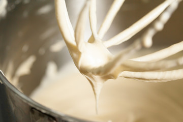 Close up texture of creamy cake batter  and mixer - obrazy, fototapety, plakaty