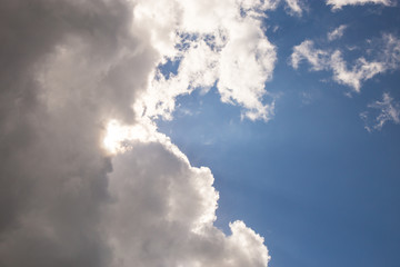 Dark clouds cover the blue sky. There is a change in the weather. Beautiful background. Ivanovo region, Russia.