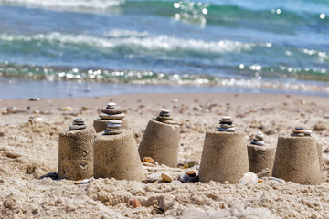 The sand castle on the sea beach - Golden Beach of Thassos, Greece, in summer, sunny day