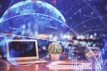 Forex graph hologram on table with computer background. Double exposure. Concept of financial markets.