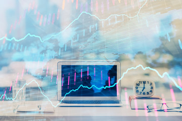 Forex Chart hologram on table with computer background. Double exposure. Concept of financial markets.