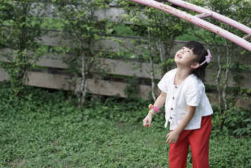 little girl at the play ground. Happiness time.