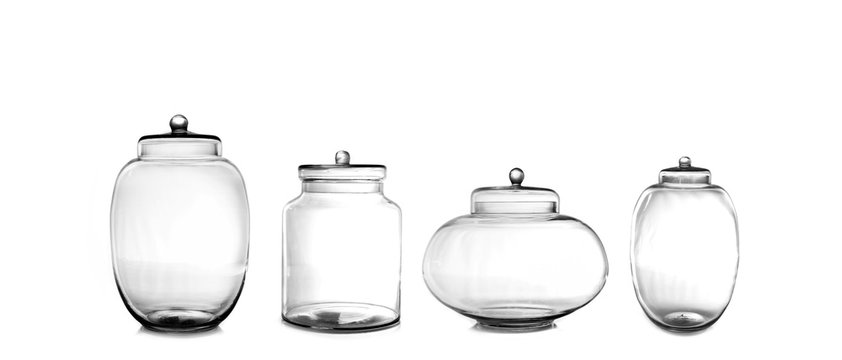 Empty glass jars isolated on white background