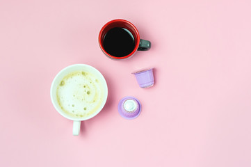 Two Cup of Coffee and Coffee Capsules on Pink Background Coffee Concept Capuccino Espresso Top View