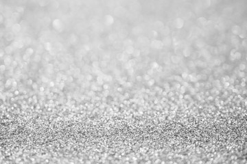 Abstract blur silver glitter sparkle defocused bokeh light background