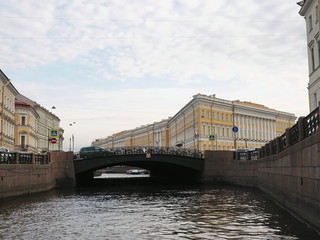 View on the Singers’ bridge from Moika river in Saint Petersburg in sunny summer day. Selective focus.