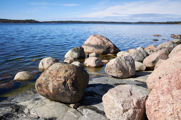 Peaceful summer landscape by the Baltic Sea in Kasnas, Kemio, Finland. Wide angle shot of the rocks on the seashore in the Finnish archipelago.