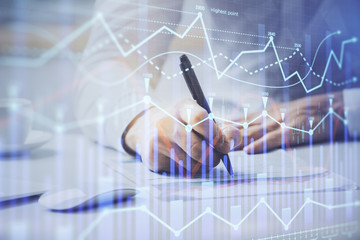 Obraz na płótnie Canvas Financial trading chart multi exposure with man desktop background.