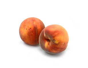 Ripe peach fruits isolated on white background.