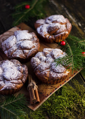 Christmas food frame on wooden background. Cinnamon rolls. Christmas homemade cakes.