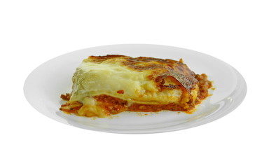 Portion of tasty lasagna. An isolated traditional lasagna made with minced beef bolognaise sauce. Tasty serving of traditional Italian lasagne with spicy tomato based ground beef and melted mozzarella