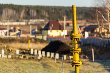 vertical gas pipeline with tap for turning on and off the supply of gas on free territory in a...