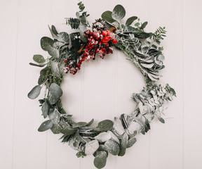 Wreath of spruce. Christmas decorations. Happy New Year holiday composition. Frame wreath with mock up copy space of fir branches on white background © paralisart