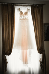 The perfect wedding dress in the room of the bride