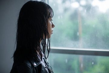 Profile beautiful young girls with wet from rain the rigid.