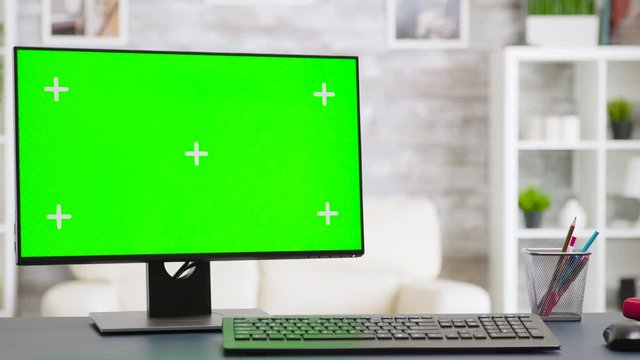Close up shot on PC monitor with green screen display