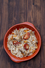 typical portuguese dish rice with duck and smoked sausage