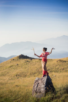 Mulayit Taung, Myanmar &ndash; mar 03 2019  Beautiful landscape panorama of young  Asia tourist at mountain is watching over the misty and foggy in morning sunrise, travel Trekking