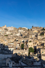 Obraz premium View of the Sassi di Matera a historic district in the city of Matera, well-known for their ancient cave dwellings. Basilicata. Italy