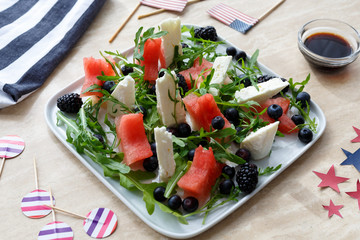 appetizer with watermelon feta cheese and arugula. Top view.