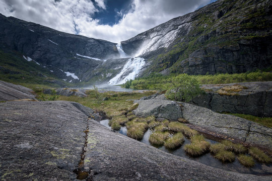 Husedalen landscape with Sotefossen waterfall in distant Norway
