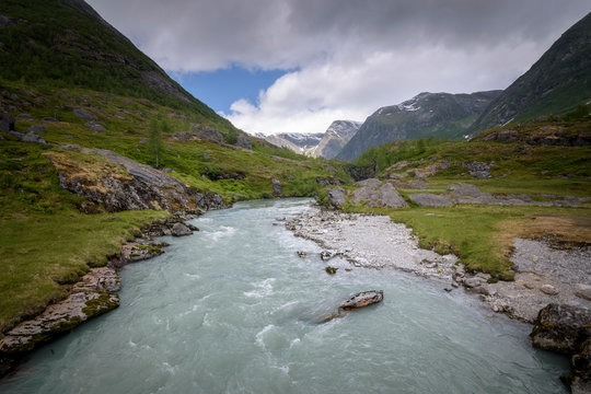 Mountain valley river in calm scenery Norway