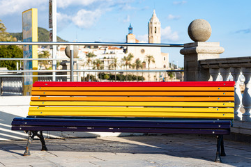 Bench painted with a rainbow colors in Sitges, Spain