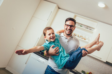 Fototapeta premium Father and son having fun at home.