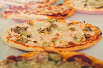 pizza with mushrooms and cucumbers closeup