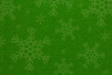 Green Christmas background with snowflakes
