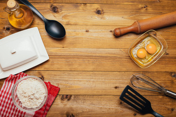kitchen utensils on wooden background