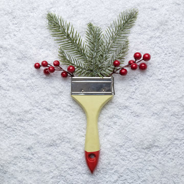Paint Brush With Christmas Decoration Abstract On Snow Background.