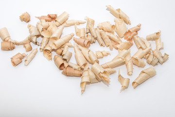 Wood shavings, beautifully curled in to a spiral isolated on white