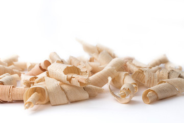 Wood shavings, beautifully curled in to a spiral isolated on white