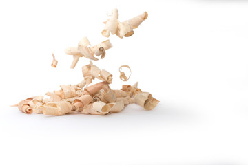 Wood shavings, beautifully curled in to a spiral isolated on white