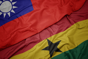 waving colorful flag of ghana and national flag of taiwan.