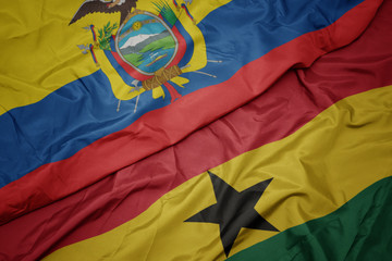 waving colorful flag of ghana and national flag of ecuador.