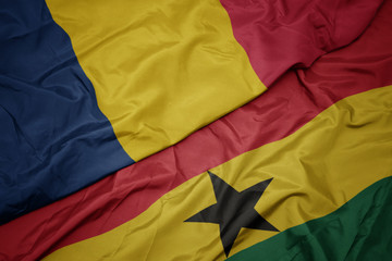 waving colorful flag of ghana and national flag of chad.