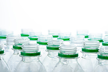 necks of plastic bottles without caps on white background