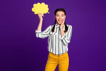 Photo of funny beautiful lady hold paper mind cloud amazed creative way of communication expressing shock wear striped shirt yellow trousers isolated purple color background