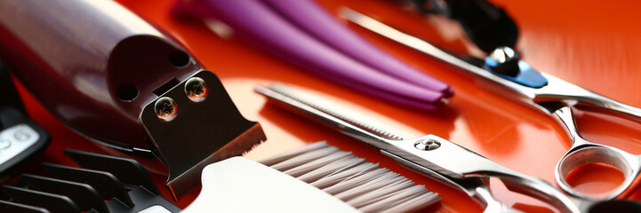 Scissors and Hairdresser Tool on Red Background