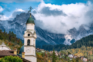 The church tower of Santa Maria Nascente, the local church of Agordo, Italy