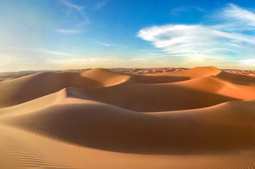 Fototapeta na wymiar Sand dunes and cloudy sky in Oman